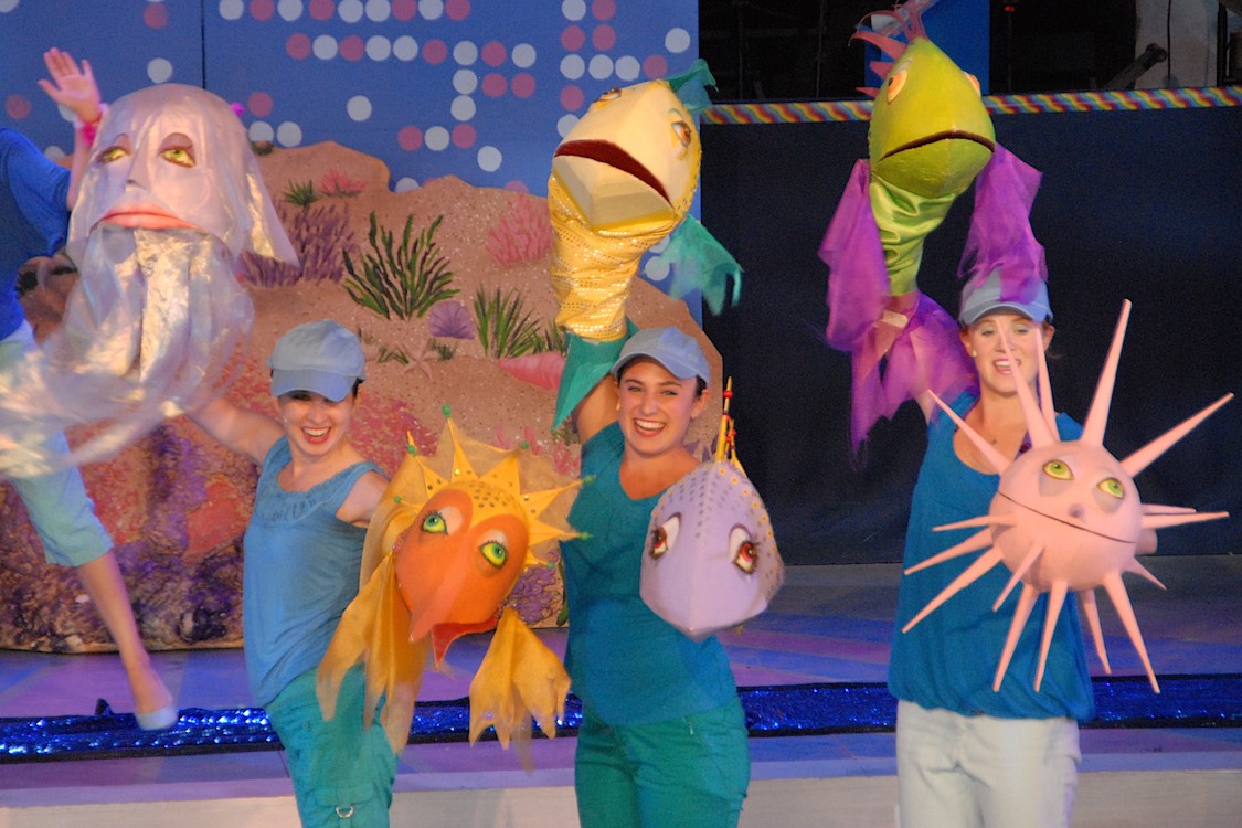 Interns performing with LIttle Mermaid Puppets